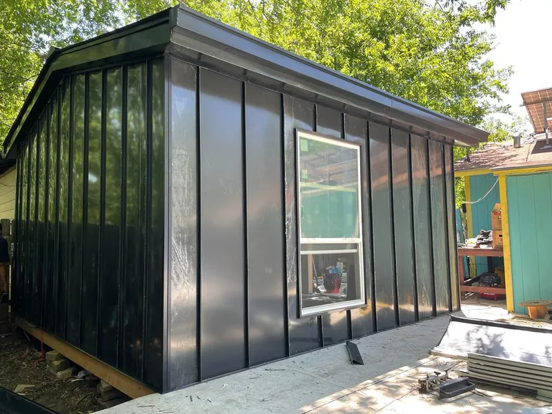 Black standing seam metal wall panels for Roof Inspection in Olivette