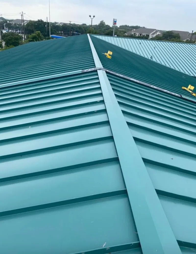 Green commercial metal roof ridge and valley for Metal Roof Repair in Olivette